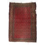 A Turkish rug, the medallion within a red central ground and stylised band border,