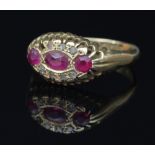 An early 20th Century ruby and diamond ring, in a galleried setting to an 18ct gold shank,