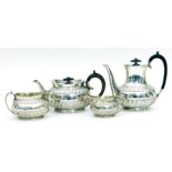 An Edwardian four-piece silver tea set, Sheffield 1901, of half lobed design,