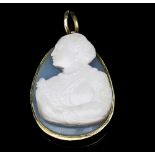 A carved hardstone cameo pendant of ovoid shape, depicting a lady in profile holding a small dog,