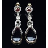 A pair of garnet and diamond ear pendants,