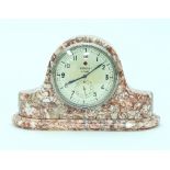 An Art Deco Zenith eight-day mantel clock, in a veined red marble case,