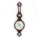 A Regency rosewood barometer and thermometer in a banjo shaped case with humidity gauge glass and