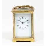 A gilt brass cased carriage clock, the white enamel dial with Roman numerals, 10.