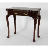 A George III mahogany fold over card table,