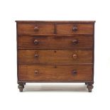 An early Victorian mahogany chest of three long and two short drawers on turned feet,