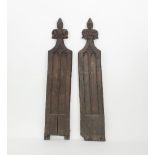 A pair of Victorian gothic oak pew ends with carved trefoil finials,