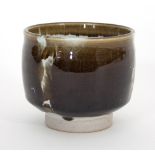 Russell Collins/A stoneware tea bowl, white over black glaze with wax resist,