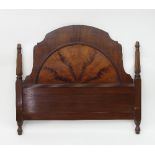 A mahogany arch top headboard with reeded columns to the sides,