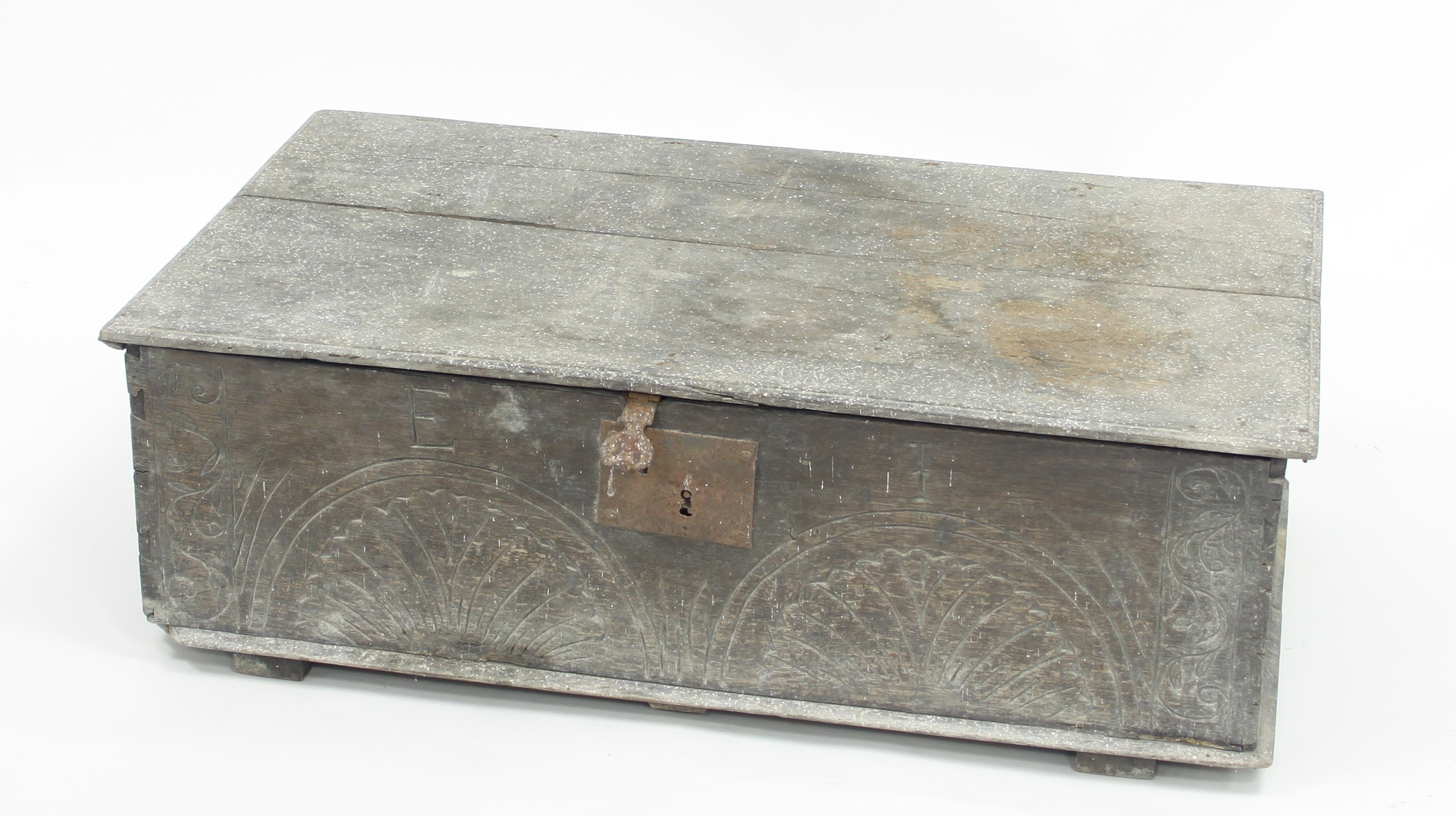 An oak bible box with carved sides and plain hinged cover, 81.