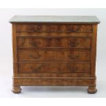 A French 19th Century walnut commode, the white marble top with canted corners,