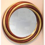 A circular mahogany and gilded wall mirror, with ribbed and twisted stylised frame, 105cm diameter,