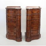 A pair of Victorian serpentine bedside chests with five-hinged drawer fronts,