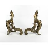 A pair of gilt bronze chenets of rococo form,