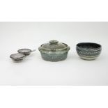 A Winchcombe pottery circular bowl and cover in green, a Winchcombe Pottery bowl in blue,