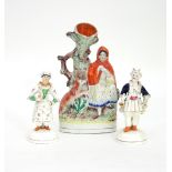 A Staffordshire figure of Little Red Riding Hood 26cm high and two other Staffordshire figures