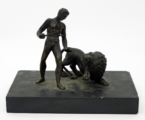 A 19th Century bronze of Androcles and the Lion, on a stone base,