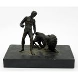 A 19th Century bronze of Androcles and the Lion, on a stone base,