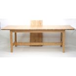 A pine kitchen table with extension leaf, to seat eight,