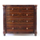 A Victorian mahogany chest of three long and two short drawers, with octagonal pillars to the sides,
