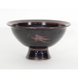 Russell Collins/A stoneware Tenmoku bowl with iron oxide decoration,