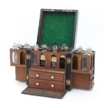 A 19th Century apothecary box, fitted with bottles,
