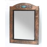 An Art Nouveau copper framed mirror,