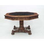 A Victorian gothic oak library table, the octagonal top with broad pollard oak border,