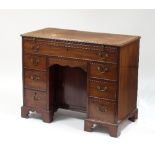 A late 18th Century Chippendale period mahogany kneehole desk,