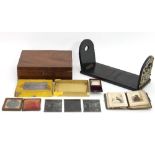 A Victorian daguerreotype, another smaller, a small Victorian photograph album,