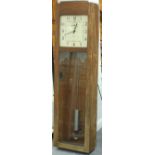 An Art Deco IBM Master Clock in an oak case with painted dial, complete with pendulum,