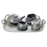 Archibald Knox for Liberty/A Tudric pewter three-piece matched coffee/tea set with twin-handled