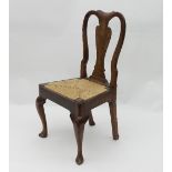 A late 18th Century fruitwood chair with vase shaped splat to the back,