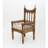 A Victorian gothic oak chair,