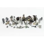 A collection of lead animals, a miniature telephone, till,