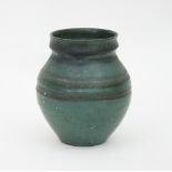 Sally Dawson/An ovoid studio pottery vase, green glazed,