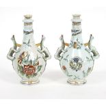 A pair of faience two-handled vases and covers, painted flowers,