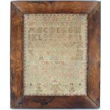 A 19th Century alphabet sampler in a rosewood frame,