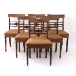 A set of six George III mahogany dining chairs, circa 1800,