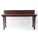 A Victorian mahogany serving table, with moulded rectangular base and border on spiral turned legs,