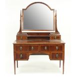 An Edwardian mahogany wardrobe, 190cm wide and a dressing table,