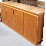 Skovby Møbelfabrik for Heals A teak sideboard of plain rectangular form fitted with four panel