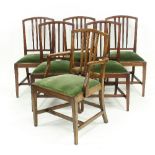 A set of six mahogany dining chairs including an armchair, each with moulded spar back,