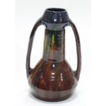 Bretby Art Pottery/An Art Nouveau style vase of conical form with splayed circular base and