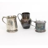 A silver drum shaped mustard pot, London 1871, a silver baluster mug, London 1909,