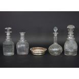 Four cut glass decanters,