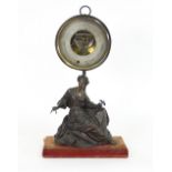 A 19th Century French aneroid barometer and thermometer, on a spelter figural base,