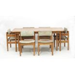 Gordon Russell/An oak dining suite comprising table, 183cm long, sideboard,