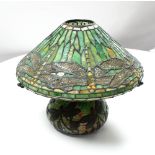 A Tiffany style lamp base and matching shade, the lead-lined coloured glass depicting dragonflies,