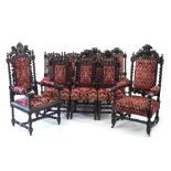 A matched set of twelve carved oak dining chairs of Jacobean design,